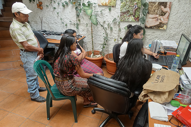 Qeqchi kaqchiquel Mayan interns learn how to draw Maya comic book characters
